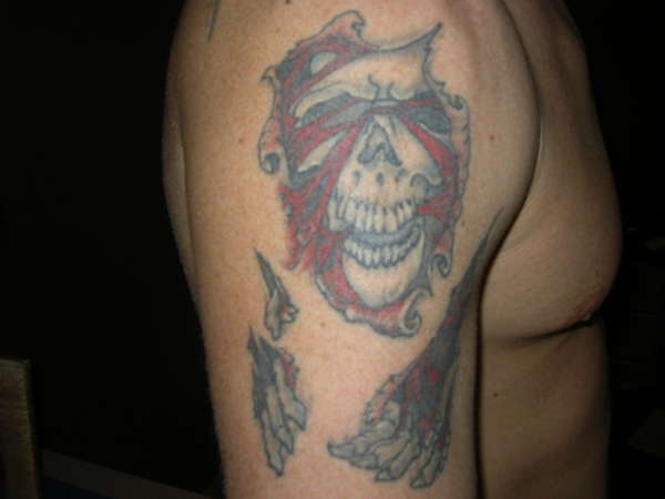 skull rip tattoo