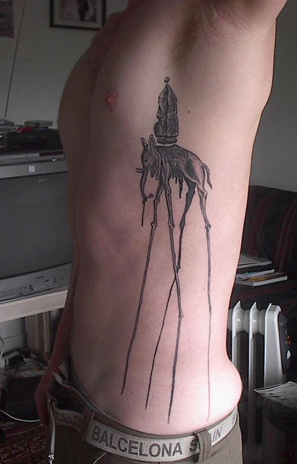 Giraffe Elephant by Savador Dali tattoo