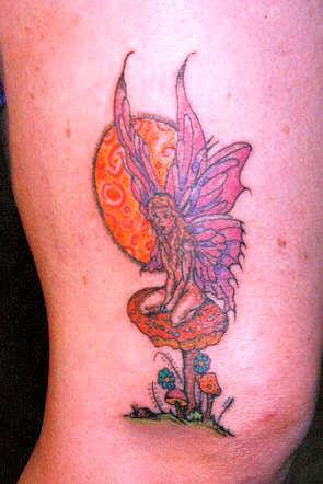 fairie sitting in a mushroom tattoo