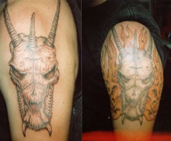 dragon skull with flames tattoo