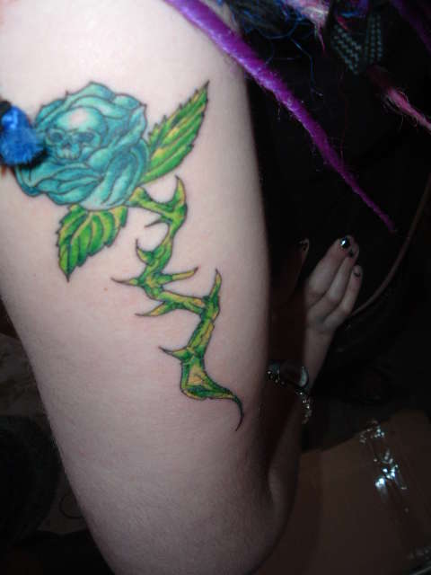 Blue skull rose tattoo