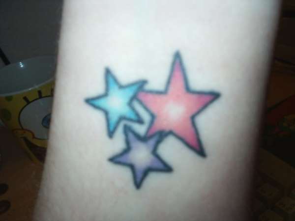 Stars on wrist - touched up tattoo