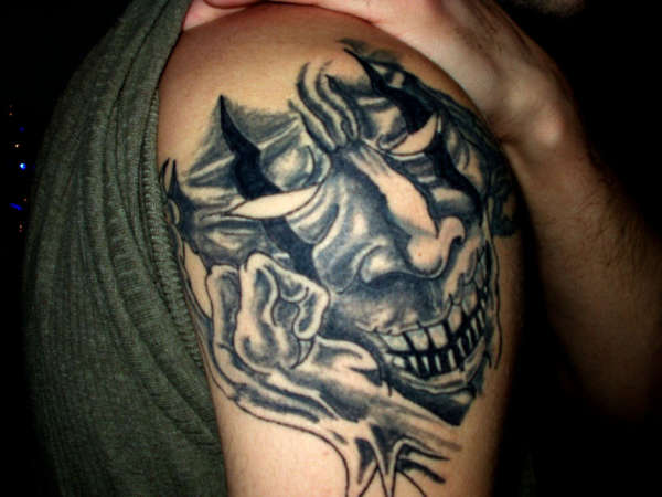 evil face tattoo