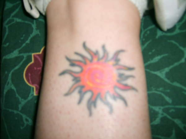 Swirly Sun tattoo