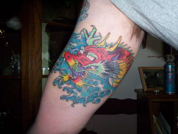 dragon on inside of arm tattoo