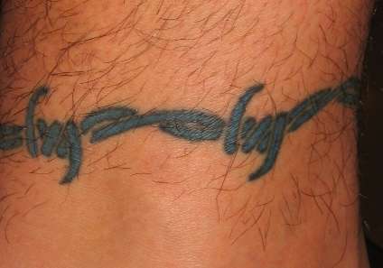Blue barb anklet tattoo