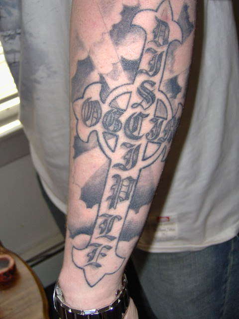 lettered cross tattoo