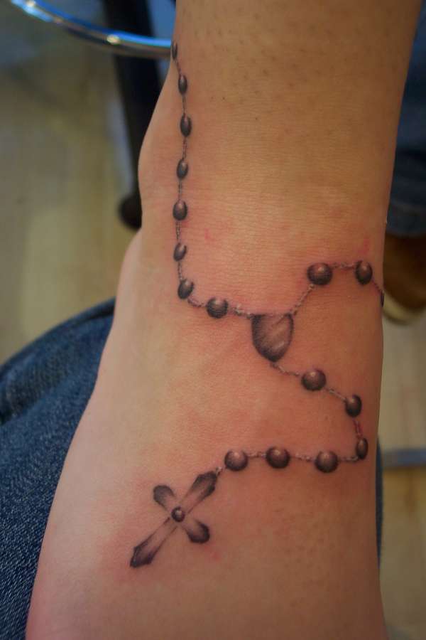 Nice lttle rosary on  ladies foot tattoo