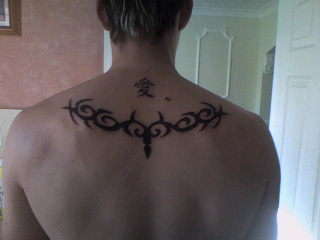 Tribal on back tattoo