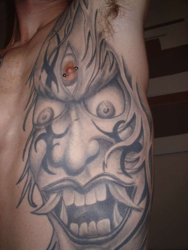 Demonic Face tattoo