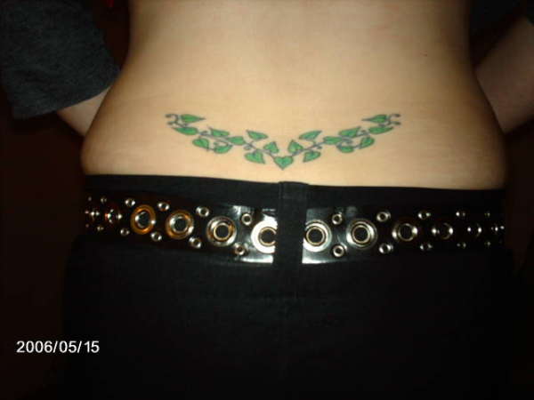 vine on lower back tattoo