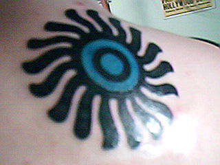 Tribal Sun on Upper Back tattoo