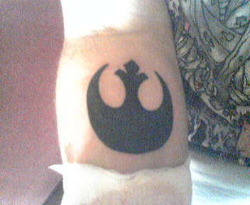rebal sign tattoo