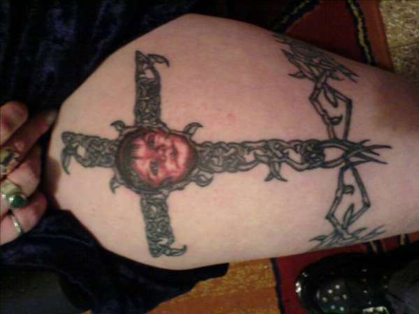 cross with portrait tattoo