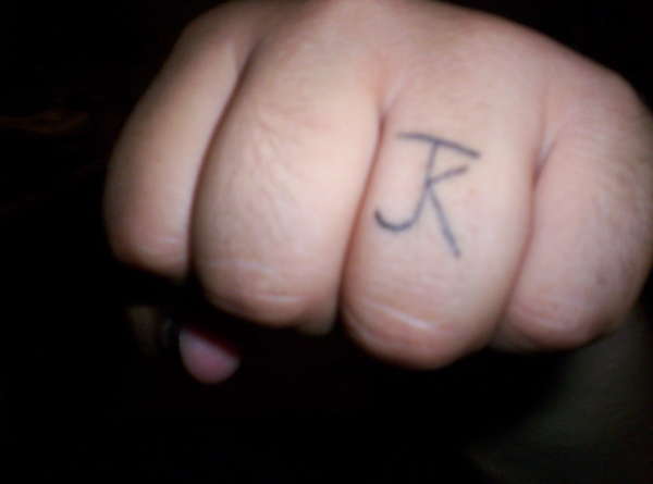 JK RING FINGER tattoo