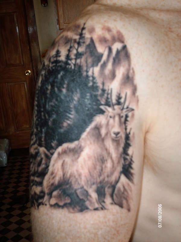 mountain goat cover up tattoo