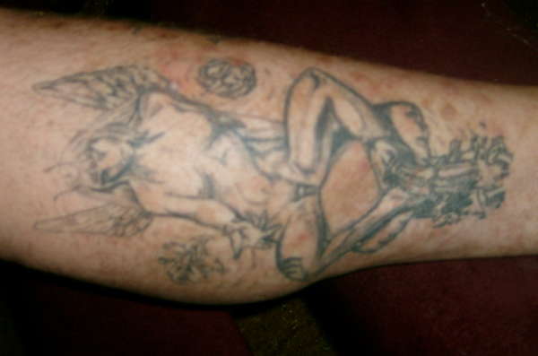 fairy controling penis with pixey in flowers tattoo