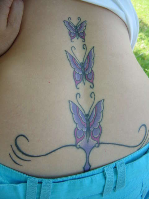 Gorgeous lower back tattoo (rising up) tattoo