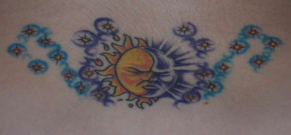 Moon, sun, and stars tattoo