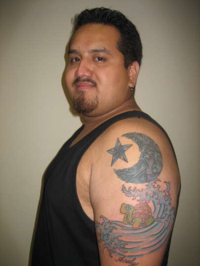 Moon star sea turtle in wave with ''ARELY'' on bottom tattoo