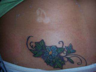 Flowers w/ vines tattoo