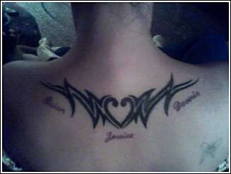 Tribal with my kids names under tattoo