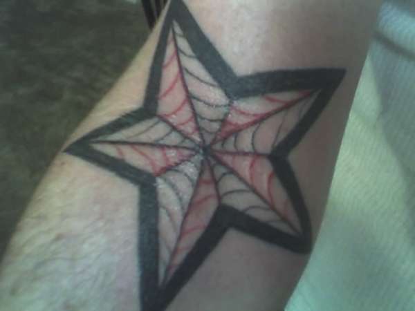 nautical spider webs tattoo