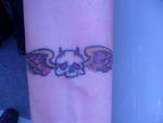 Skull with wings tattoo