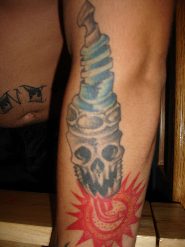 skull plug tattoo