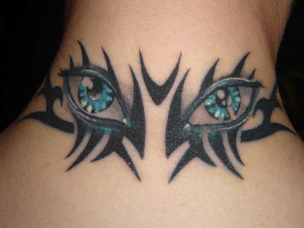tribal eyes tattoo