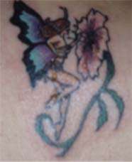 Fairy and flower tattoo