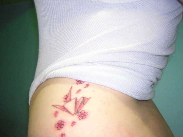 paper crane and flowers tattoo