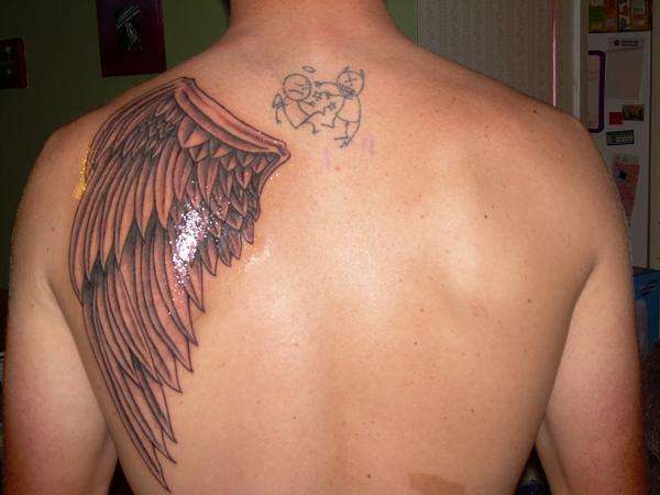 left side (angel wing) tattoo