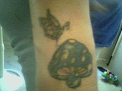 butterfly/mushroom tattoo