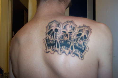 Three skulls tattoo
