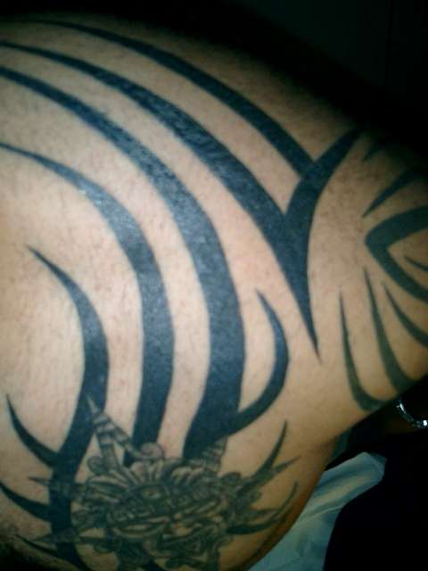 tribal shoulder piece tattoo