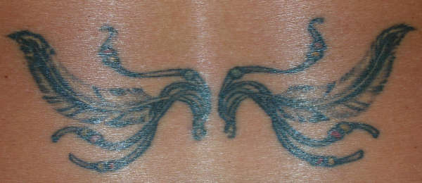feathers and beads tattoo