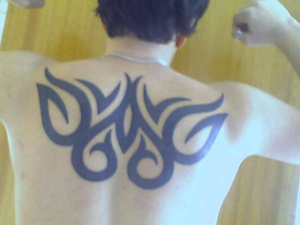 Upper back tribal tattoo