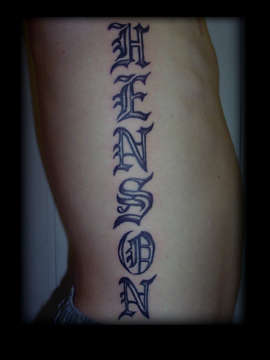 Old E down the ribs tattoo