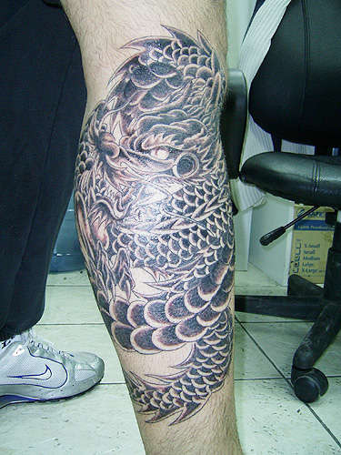 Freehand Dragon on lower leg tattoo