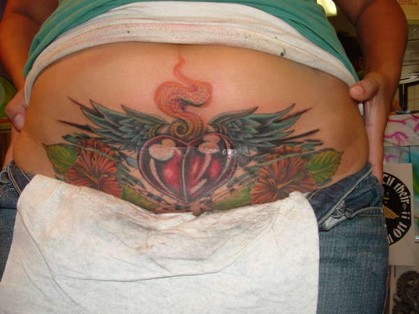 sacred heart and wings tattoo