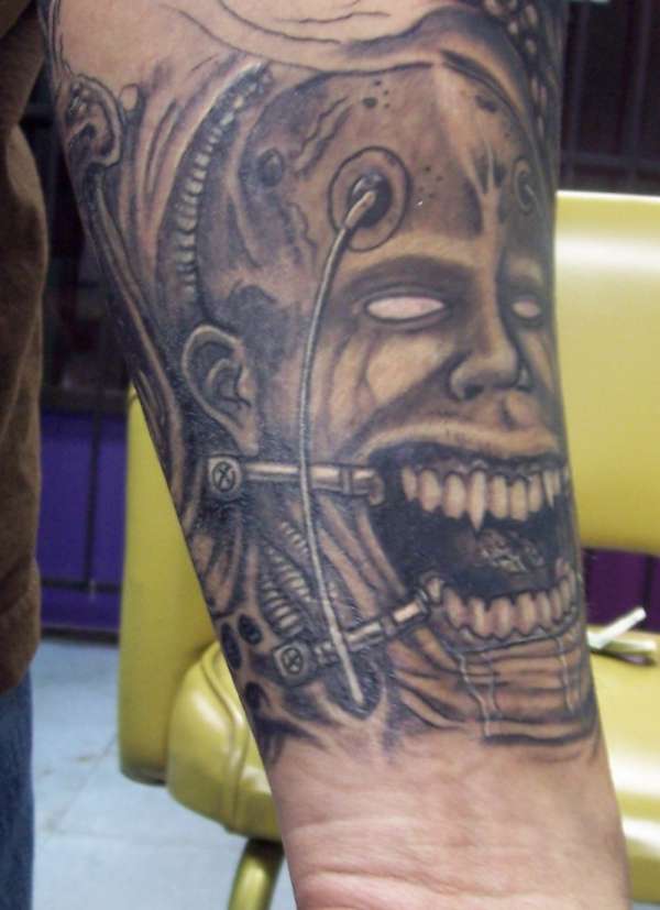 Twisted Face tattoo
