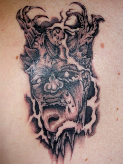 demon/gargoyle creature tattoo
