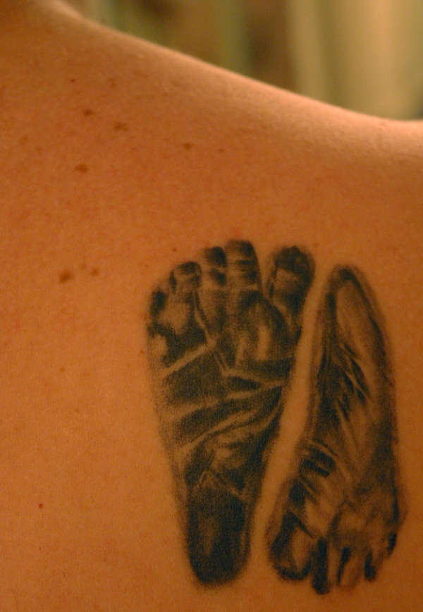 Kids' footprints tattoo