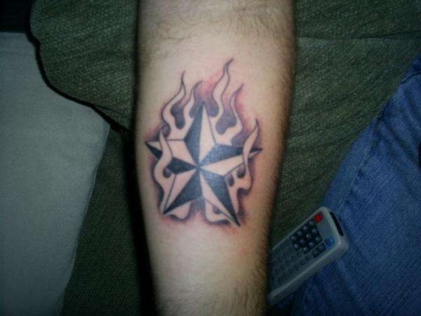 Nautical star w/flames tattoo