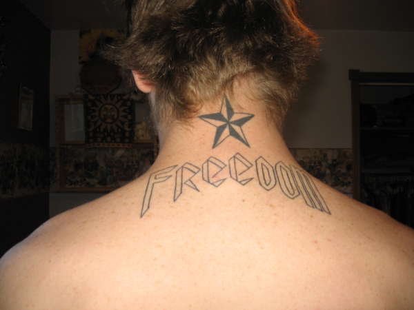 Star and freedom banner tattoo