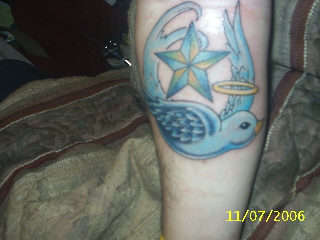 good and evil swallows tattoo