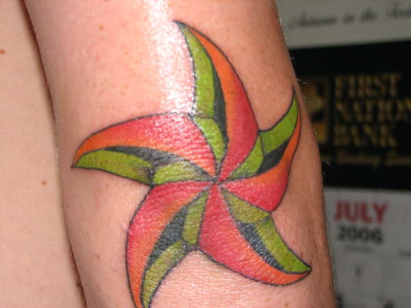 nautical star on elbow tattoo