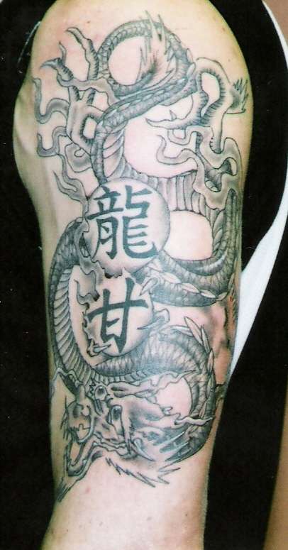 Dragon with kanji tattoo