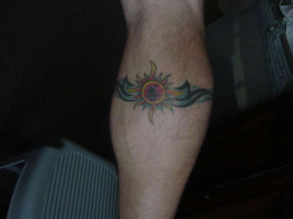 Sun and Tribal tattoo